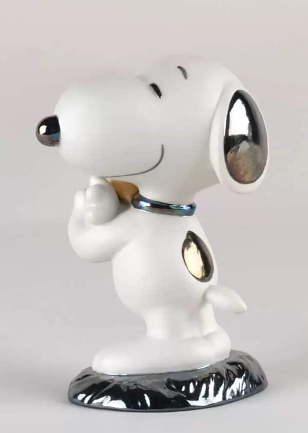 Lladro Snoopy Figurine. Left