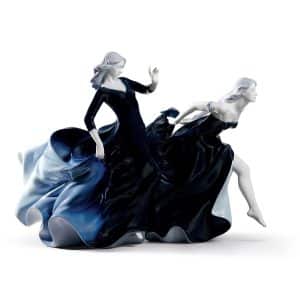 Lladro Night Approaches Woman Figure. Limited Edition. Glossy porcelain figurine of two beautiful women with long and voluptuous dresses of a deep blue degraded color.