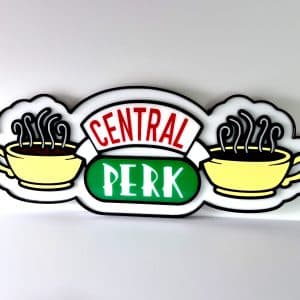 Front view of a premium 3D layered acrylic Central Perk wall sign, precision-cut from high-gloss green, red, yellow, and white acrylic sheets on a black backing.