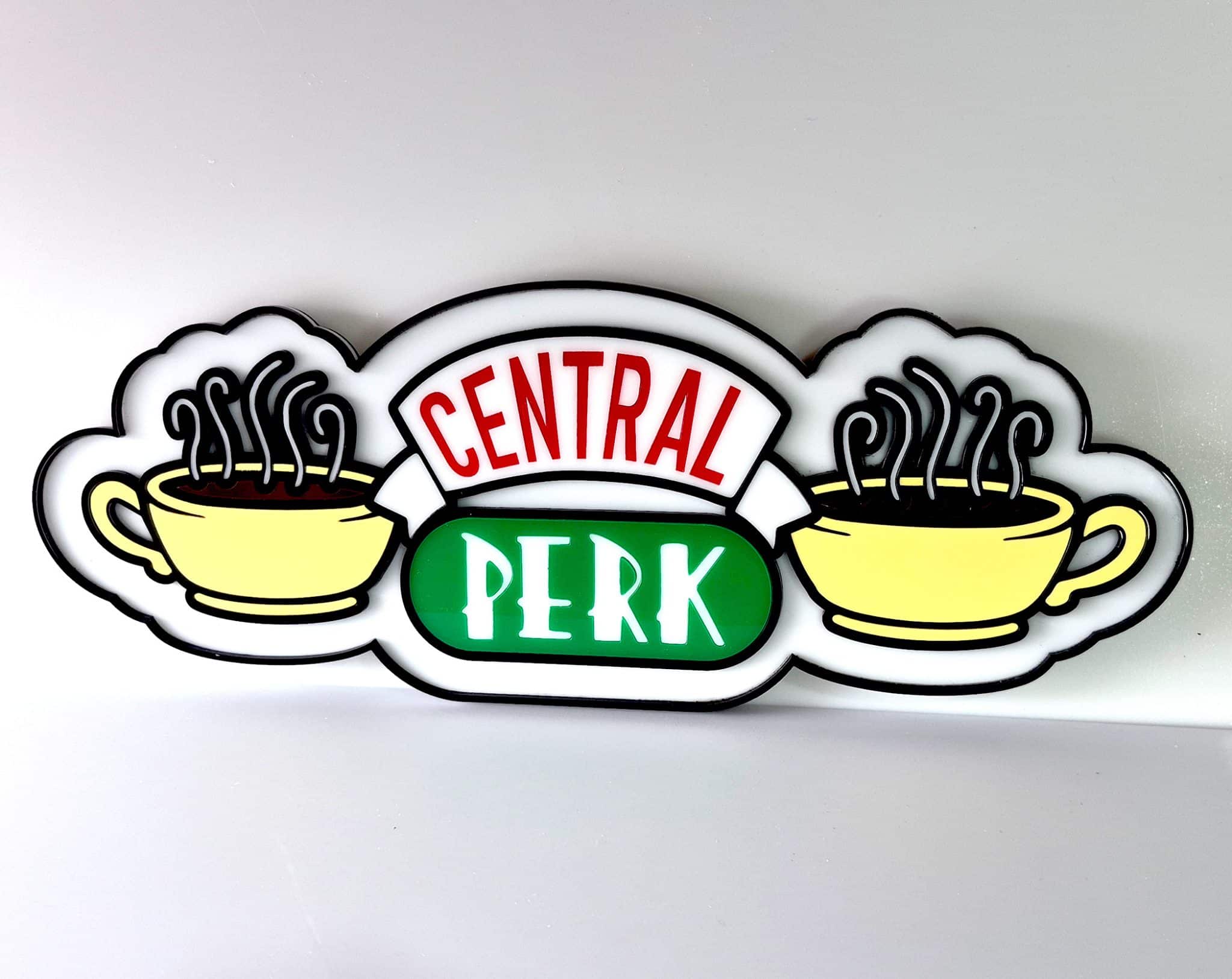 Front view of a premium 3D layered acrylic Central Perk wall sign, precision-cut from high-gloss green, red, yellow, and white acrylic sheets on a black backing.
