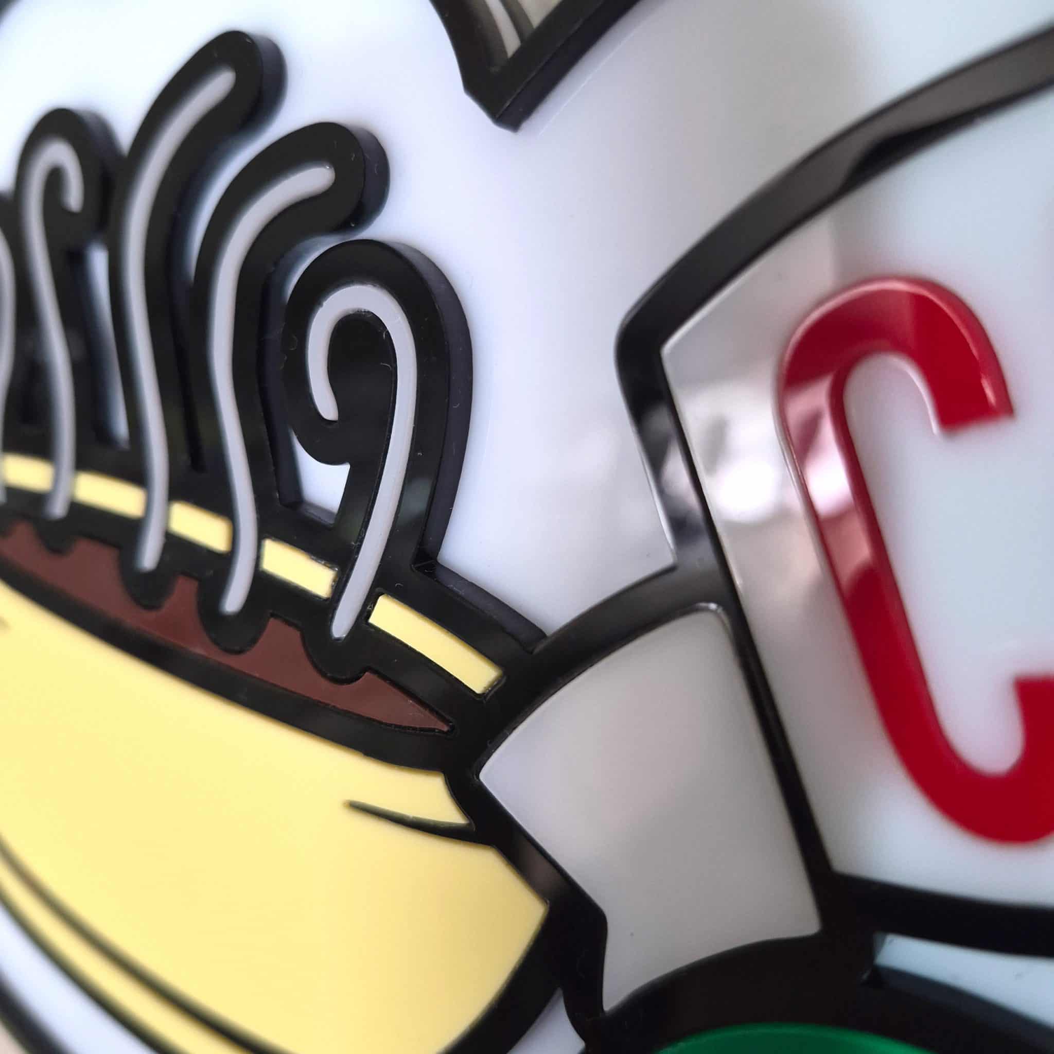 Angled side-view of a 420mm Central Perk acrylic sign capturing the reflective mirror-gloss sheen and the tangible depth of the multi-layered 3mm design.