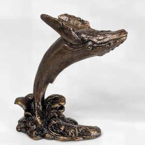 Solid bronze humpback whale sculpture leaping backwards to the right with multi-tonal patina finish by Marquise Jewellery