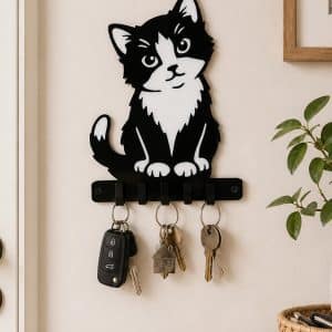 Handmade black and white inlaid acrylic kitten key holder measuring 200mm high by 140mm wide with 5 key hooks installed in Hallway with Keys