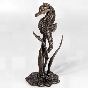 Solid bronze seahorse sculpture anchored among seagrass on a decorative base with multi-tonal patina finish by Marquise Jewellery