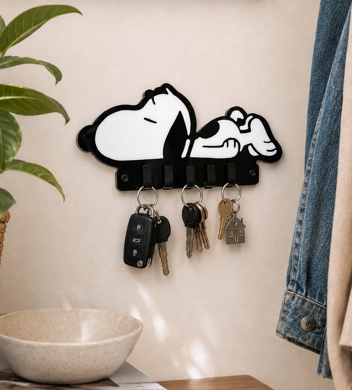 Handmade black and white inlaid acrylic Sleeping Snoopy Dog Keyring Hanger mounted on a hallway wall with sets of keys hanging from 5 integrated hooks